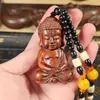 Estatua Pequeña de Buda Tathagata Tallada en Sándalo Rojo Hoja Pequeña Sakyamuni Pieza de Mango Colgante Artesanal Talla de Madera