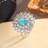 Anillo Elegante de Zirconia Azul Claro de Lujo Accesible con Zafiro Retro de Gama Alta y Imitación de Algodón Paraíba Natural