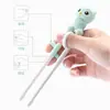 Palillos de aprendizaje para bebés de dibujos animados de plástico palillos de entrenamiento para bebés palillos de práctica de corrección para niños palillos para comer fabricantes mayoristas