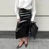Falda de Cuero PU de Gama Alta de Longitud Media Diseño Nuevo Transfronterizo Otoño e Invierno Falda de Cuero con Abertura Femenina y a la Moda