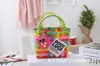 Bolso pequeño cuadrado tejido de plástico a juego con el color, cesta de regalo de mano, bolso de mano casual versátil para mujer, bolsa de compras, cesta de verduras