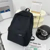 Mochila de viaje simple de gran capacidad para hombre, mochila casual estilo japonés para mujer para estudiantes de secundaria, preparatoria y universidad