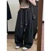 Foto real de los nuevos pantalones anchos de cintura elástica de estilo coreano para el otoño de 2026 con una caída holgada y casual 19640