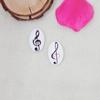 Producción de fábrica al por mayor Accesorios para joyería DIY Patrón ovalado de nota musical maravillosa Parche de vidrio Time Gem
