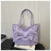 Bolsa de ombro estilo Y2K retrô para mulheres, design de nicho coreano com um laço, bolsa tote de lona casual e versátil com grande capacidade