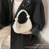 Bolso Cruzado de Hombro de Media Luna Versátil Retro de Gama Alta de Nicho Transfronterizo Nuevo para Mujer 2026
