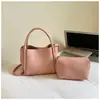 Bolso de mano de alta costura transfronterizo para mujer, nuevo y elegante bolso tipo cesta cubo con patrón de lichi, bolso de hombro y cruzado para el día a día, moderno