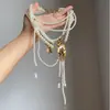 Collar de borla con cuentas florales azules de alta gama para mujer, un choker único para superponer, cadena para la clavícula chic y versátil