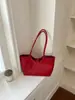 Textura tramada popular bolsa de axila feminina nova de alta qualidade nicho para o dia a dia bolsa mãe e filho bolsa versátil de ombro única moderna