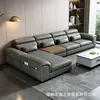 Sofá de cuero gris oscuro de lujo ligero estilo italiano con ribete naranja, respaldo segmentado y chaise longue para sala de estar del hogar