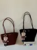 Bolsa de bowling coreana de nicho em formato de coração para mulheres, nova bolsa tote transversal simples e versátil 2026, bolsa de mão para o dia a dia
