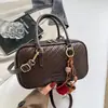 Otoño 2026 Nuevo Color Sólido Personalizado Elegante Bolso Almohada de Mano Alto Valor Nicho Retro Textura Tejida Bolso Cruzado