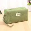 Bolsa de maquillaje de mano de tela Oxford para mujer, bolsa cuadrada pequeña simple, bolsa de almacenamiento de cosméticos portátil de gran capacidad, venta al por mayor, se puede imprimir con texto