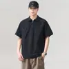 Camiseta casual holgada de manga corta con cuello y media cremallera, nueva tendencia para hombre, verano 2026