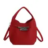 Bolsos Pequeños Transfronterizos para Mujer 2025 Nuevo Color Sólido Bolso Tipo Kelly Bolso Popular Bolso Cubo Bolso de Hombro Cruzado de Nicho