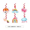Decoraciones para fiesta de cumpleaños infantil con temática de arcoíris, que incluyen platos de papel desechables, pancartas, banderines y artículos decorativos