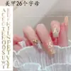 Explotaciones transfronterizas 26 letras traje joyería para uñas aleación rhinestone letra japonesa inglesa joyería para uñas palillo para uñas taladro