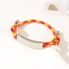Al por mayor al contado transfronterizo Pulsera de doble cordón de ajuste Pulsera de cuerda trenzada ajustable de acero inoxidable multicolor con impresión y grabado de color UV
