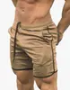 Amazon shorts de verão masculinos de secagem rápida cor sólida esportivos fitness calças de cinco pontos calças de praia fabricantes atacado