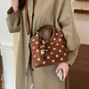 2026 bolso cubo de terciopelo retro lunares patrón exquisito otoño bolso de mujer moda madre e hijo hombro gamuza bolso de mano cruzado estilo nuevo
