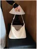 Bolso Retro de un Hombro para Mujer 2026 Nuevo Estilo Bolso de Hombro Tejido de Moda Bolso Tote de Mano de Gran Capacidad Simple Elegante