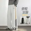 Pantalones de chándal a rayas estilo americano, nueva colección de otoño, corte holgado, caída fluida, diseño de bloques de color, detalles bordados, versátiles para deportes y uso casual, de longitud larga