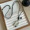Cordón de Cuero Negro Colgante Ovalado Collar Largo Cadena para Suéter Simple Versátil Gama Alta Lujo Ligero Geométrico Moda Estilo Unisex