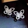 Pendientes de mariposa fantasma versión Gelagao Pendientes dorados versión Seiko pendientes mujer Moda europea y americana pendientes mujer al por mayor
