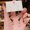 Pendientes largos de estilo coreano, negros, con flecos de perlas en espiral con efecto de goteo de aceite, únicos y versátiles, efecto adelgazante, pendientes de otoño e invierno