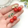Versión Coreana DIY de Pegamento Cinco Colores Cereza Collar Hecho a Mano Colgante para Bolsa Pendientes Accesorios de Joyería Material Fabricante Mayorista