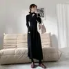 Otoño 2023 Nuevo elegante vestido suéter negro Francés manga larga base tejido vestido de punto mujer otoño e invierno