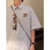 Verano Retro Americano Holgado de Moda Marca Bordado de Dibujos Animados Diseño Único Camisa de Manga Corta Tops para Hombres y Mujeres Camisas de Moda