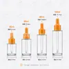 Botella gotero transparente para esencia 20 ml 30 ml 50 ml Botella de aceite esencial macarrón Botella gotero de vidrio de grado alimenticio Botella rellenable