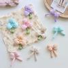 Nueva primavera flor de trébol de seda brillante algodón lazo tridimensional flor de tres pétalos corazón de niña accesorios de ropa