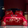 Juego de ropa de cama de cuatro piezas de algodón de fibra larga, de alta gama y lujoso, para bodas, con colores rojos, algodón puro y diseños bordados para un aspecto festivo y elegante.