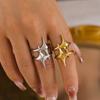 Anillo de estrella de viento frío con revestimiento de acero de titanio chapado en oro real de 18 quilates para hombre y mujer, estilo europeo y americano.