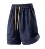 Bienes de Fujian protección solar para exteriores no sofocantes holgados de pierna recta pantalones cortos para hombre de moda cintura elástica pantalones de cinco puntos