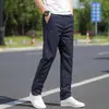 Pantalones casuales versátiles para hombre, rectos, holgados, elásticos, pantalones de traje, nuevos de otoño, ajustados, de negocios, de trabajo, pantalones de otoño para hombre