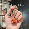 Pingente de chaveiro de sino de cachorro fofo resina filhote de animal de estimação chaveiro criativo pingente para chaveiro de carro bolsa