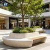 Banco curvo de terrazo para árbol, ideal para plazas exteriores de campus, con asiento de madera, cerramiento para árboles y jardineras. Venta al por mayor.