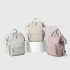 Nueva mochila de moda transfronteriza para mamás con gran capacidad, resistente al agua, separación de húmedo y seco, almacenamiento simple para madres y bebés
