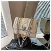 Bolso de cadena acolchado estilo Chanel para mujer, nuevo bolso cruzado mini de moda versátil 2026, bolso cuadrado pequeño popular