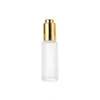 Botella dispensadora de aceite esencial esmerilada con hombro plano, cabezal de bomba de presión, frasco gotero, botella cosmética de vidrio transparente portátil de 15-50 ml