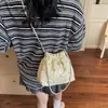 Bolso de cubo transfronterizo estilo Chanel para mujer, nueva versión coreana verano 2026, bolso de hombro y cruzado elegante y versátil con estampado de estrellas