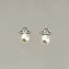 Pendientes de Perla Gris Saturno para Mujer 2026 Nueva Moda Pendientes de Verano Lujo Ligero Aleación de Alta Gama Adornos para Orejas