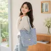 Nueva bolsa de lona de rayas de doble cara para mujer estilo coreano viento perezoso bolsa de mano de gran capacidad para clase y viaje bolsa de lona de mano
