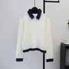 Otoño temprano 2026 nuevo estilo patchwork de mezclilla en bloques de color cárdigan de punto con cuello de solapa chaqueta suéter casual versátil de imitación de dos piezas para mujer