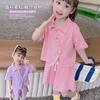 Traje de niña 2024 Verano Nuevo Bebé Femenino Manga Corta Top Pantalones Cortos Dos Piezas Cabello Transfronterizo