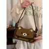 Bolso de axila estilo retro de alta gama para mujer 2025 Nuevo bolso cuadrado pequeño de gamuza Bolso cruzado de oso de peluche lindo de dibujos animados