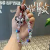 Popular Pulsera de Muñeca para Teléfono de Mariposa Pintada en Acrílico en TikTok - Versátil y Universal para Fundas de Teléfono, Amuletos de Mano, Cadena Antiperdida